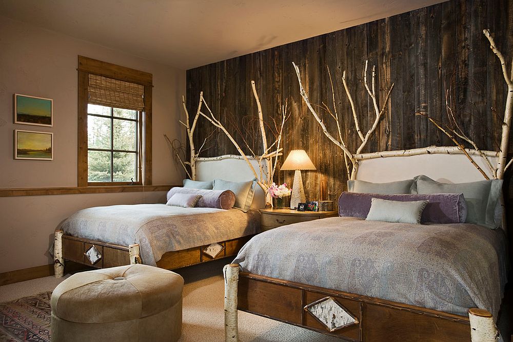 Birch wood branches and reclaimed wood wall for a comfy and rustic bedroom