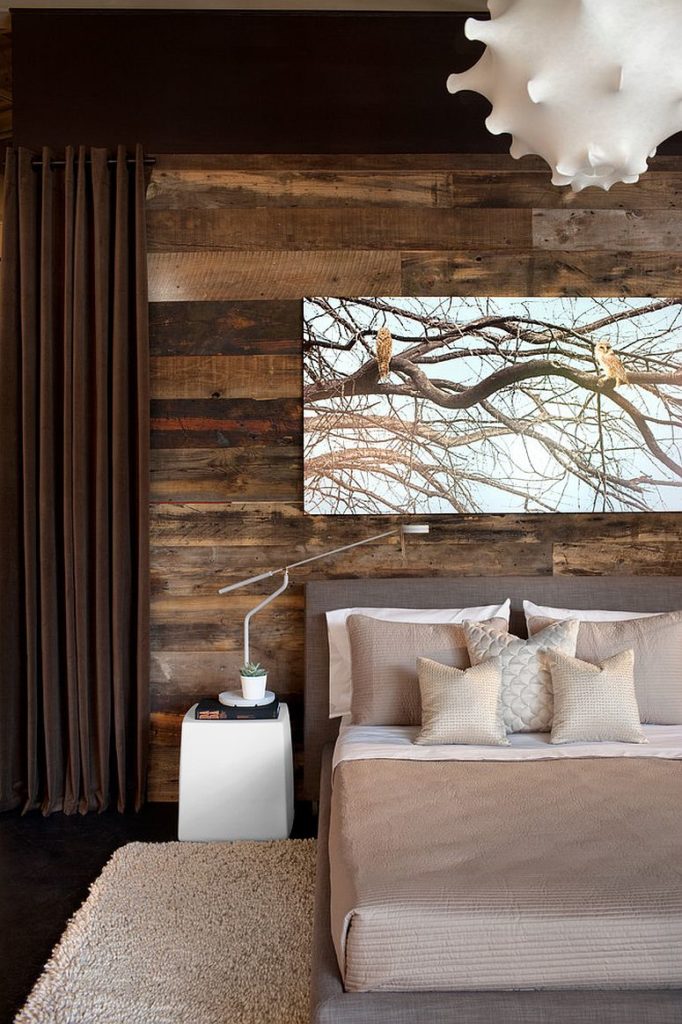 Rustic design with the use of reclaimed wood horizontally lined in the contemporary styled bedroom with big photo on canvas