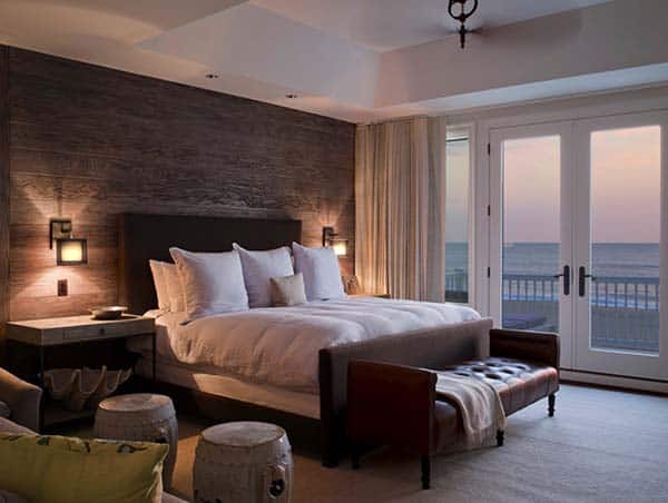 Another room with a view, this time the Seaside View through the french doors to the balcony. The bedroom has a dark wood feature wall with built in light