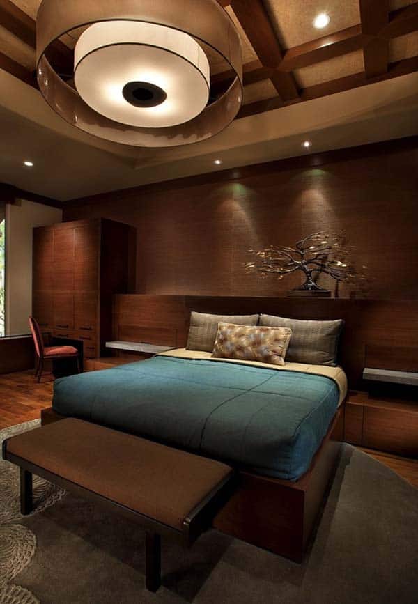 All round wood clad bedroom walls with soft lighting