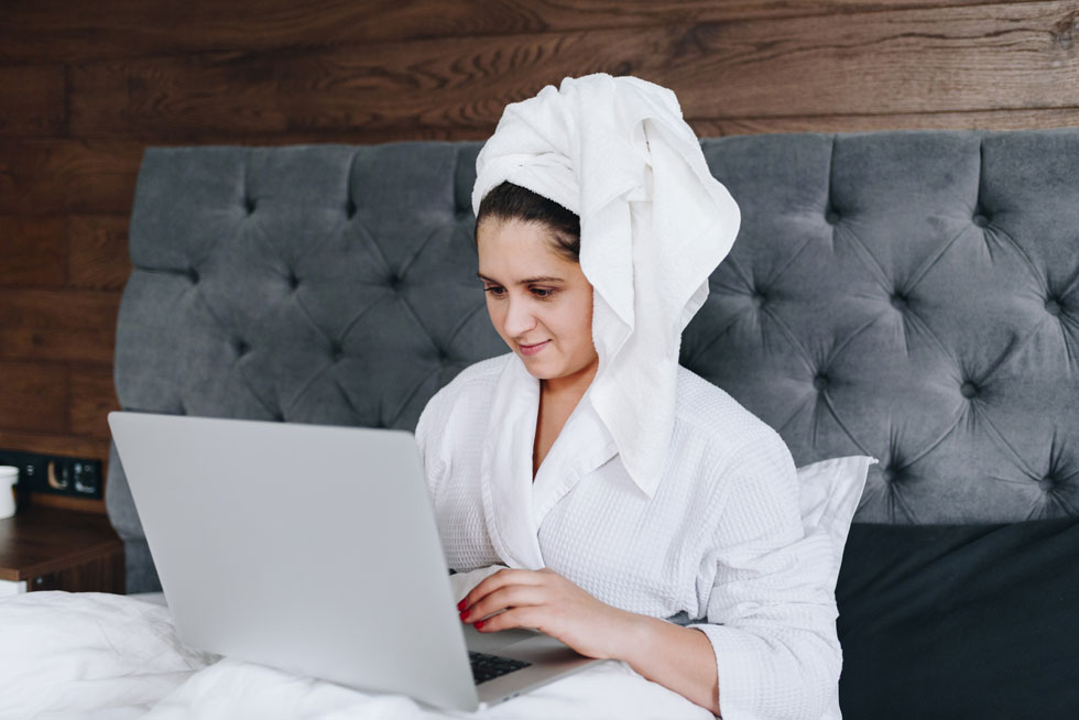 Working from home in a bath robe and hair towel