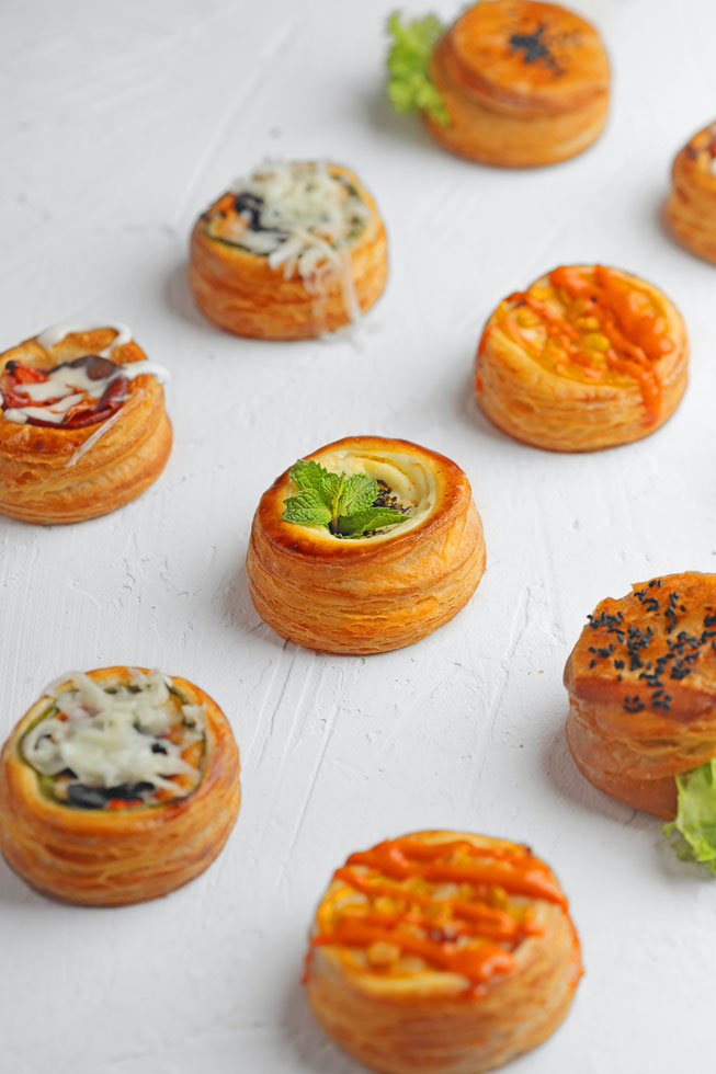 Savoury treats of filled puff pastry tartlets